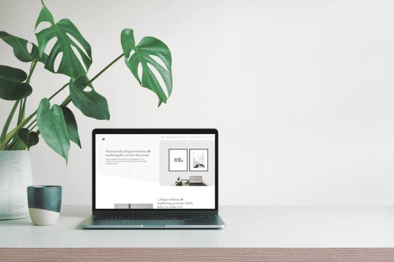 gently created web design on an open laptop on a desk