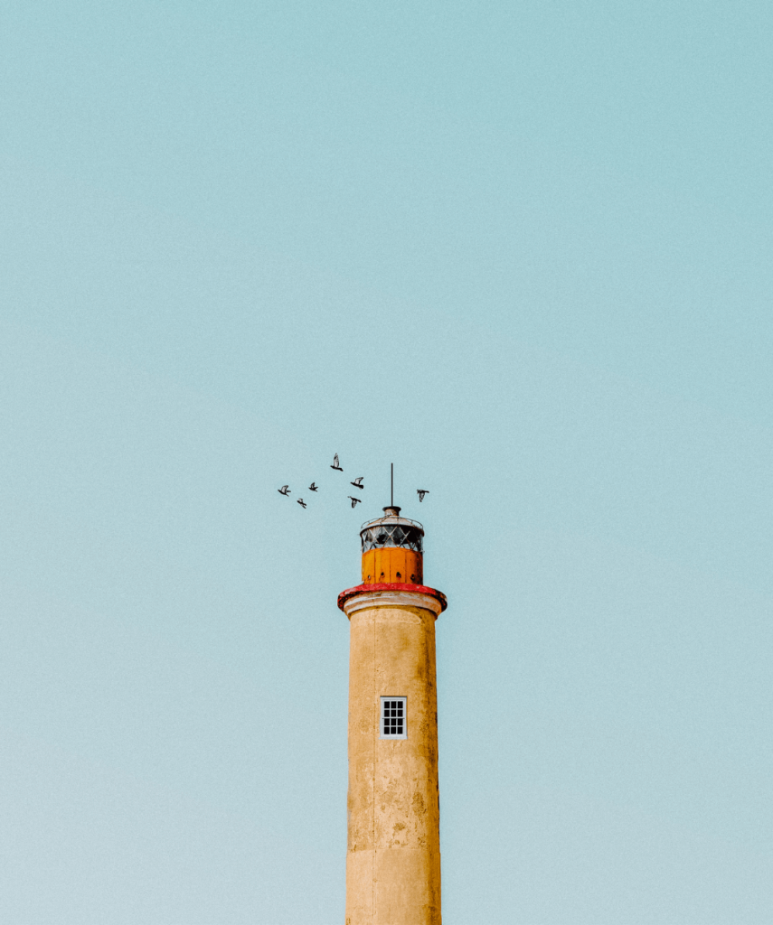 Top of a lighthouse against a beautiful blue sky
